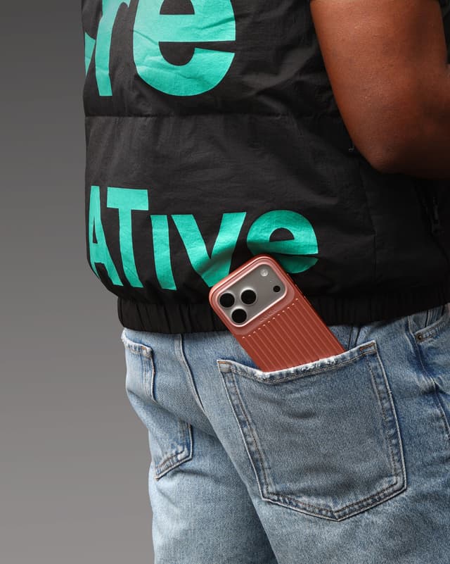 CLICK Nova ribbed phone case peeking out of a denim back pocket
