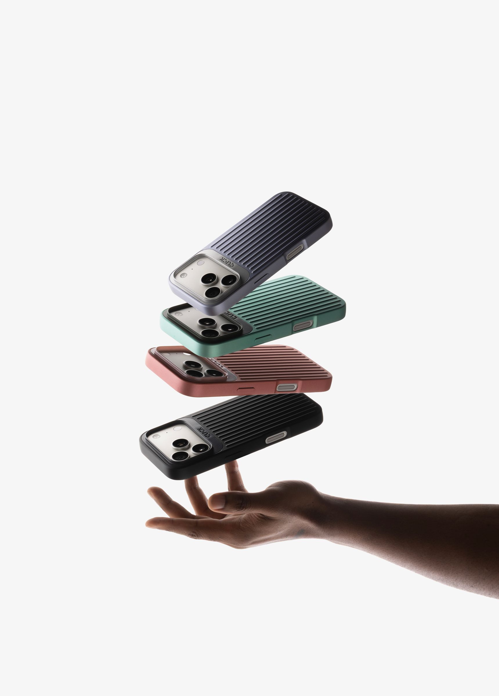 Four CLICK Nova cases stacked and balanced on an upturned hand